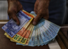 Mercado financeiro prevê inflação menor, aumento do PIB e dólar mais barato
